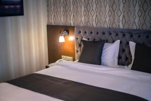 Postel nebo postele na pokoji v ubytování Park Hotel