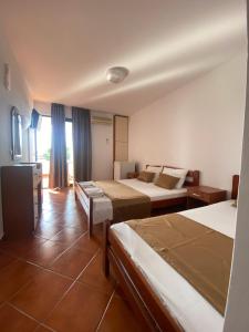 Postel nebo postele na pokoji v ubytování DeLux Apartmani