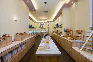 a bakery with a glass jar on a counter at Isida Hotel Agia Marina in Agia Marina Nea Kydonias