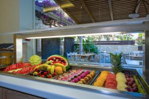a display case with a variety of fruits and vegetables at Isida Hotel Agia Marina in Agia Marina Nea Kydonias