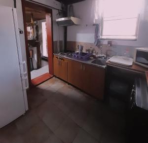 a kitchen with a sink and a counter top at Ranch American in Târgovişte +39 photos