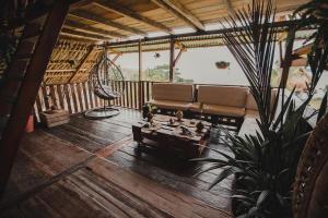 a living room with a couch and a table at Bayano Ecolodge in Chepo