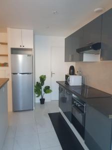 Køkken eller tekøkken på Sublime & neuf Studio près de CDG-Parc d'expo