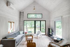 a living room with a couch and a tv at Unique holiday home in Mankarbo, Uppsala 