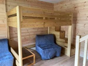 a room with a bunk bed and two chairs at Maglines in Vars