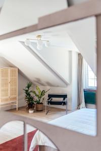 a bedroom with a bed and a staircase at Villa Parkbos in De Pinte