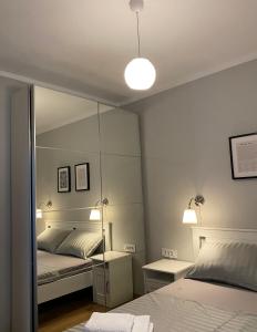 Posteľ alebo postele v izbe v ubytovaní M Plus Residence