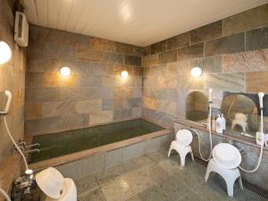 Vannituba majutusasutuses Tabist Hamatoya Ryokan Mens Only