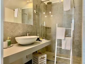 a bathroom with a bowl sink and a shower at Giardino Botanico in Ragusa +31 photos