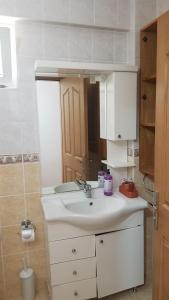 a bathroom with a sink and a mirror at Huge Evleri 2 in Marmaris +67 photos