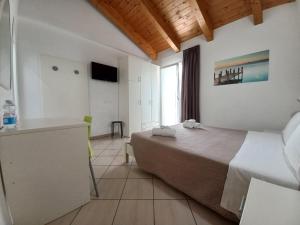 TV a/nebo společenská místnost v ubytování Hotel Sasselli