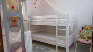A bed or beds in a room at Sea La Vie