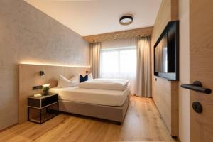 Posteľ alebo postele v izbe v ubytovaní Haus St Anton - INKL PREMIUM SOMMERKARTE