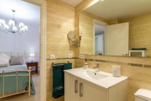 a bathroom with a sink and a mirror at Sun, Sea, Beach Costa Calida Spain Henrys Apartment in Águilas