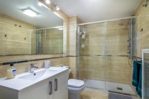 a bathroom with a sink and a shower and a toilet at Sun, Sea, Beach Costa Calida Spain Henrys Apartment in Águilas
