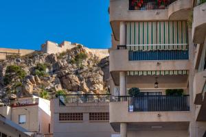 a view of buildings in front of a mountain at Sun, Sea, Beach Costa Calida Spain Henrys Apartment in Águilas