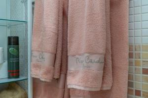 a pink towel is hanging in a bathroom at Sun, Sea, Beach Costa Calida Spain Henrys Apartment in Águilas +37 photos