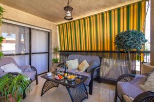 a living room with chairs and a table at Sun, Sea, Beach Costa Calida Spain Henrys Apartment in Águilas