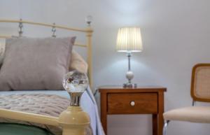 a bedroom with a bed and a table with a lamp at Sun, Sea, Beach Costa Calida Spain Henrys Apartment in Águilas