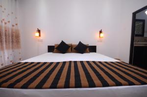Ένα ή περισσότερα κρεβάτια σε δωμάτιο στο L&D Lodge