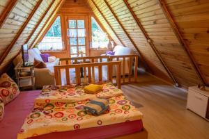 a bedroom with a bed in a wooden cabin at Ferienhaus Gitti in Freest