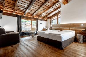 Postel nebo postele na pokoji v ubytování Curt di Clement Eco Mobility Hotel + 37 fotografií