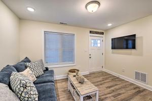 a living room with a couch and a tv at Wildwood Condo with Pool Access - Walk to Beach in Wildwood