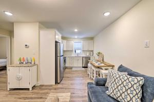 a living room with a couch and a kitchen at Wildwood Condo with Pool Access - Walk to Beach in Wildwood