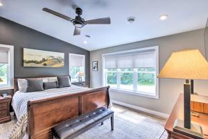 a bedroom with a bed and a ceiling fan at Chic Plymouth Townhome Less Than 1 Mi to Road America in Plymouth