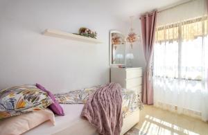 a bedroom with a bed and a window at Sun, Sea, Beach Costa Calida Spain Henrys Apartment in Águilas