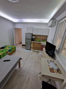 a room with a kitchen and a living room at lux in Plovdiv