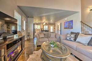a living room with two couches and a table at Granbury Home with Hot Tub and Furnished Patio! in Granbury