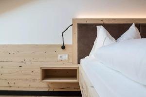 Postel nebo postele na pokoji v ubytování Natur Suite Edelweisshof App Georg