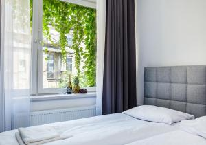 Posteľ alebo postele v izbe v ubytovaní Aparthotel Cracovia Residence