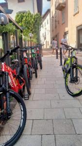 a row of bikes parked next to a fence at Villa Grazia in Serina