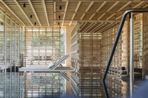 a large room with wooden blinds on the windows at Sensoria Dolomites in Siusi