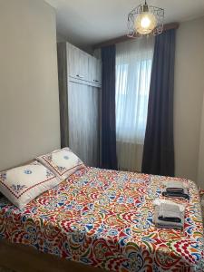 Postel nebo postele na pokoji v ubytování Apartments on Bakradze