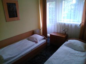 Кровать или кровати в номере Hostel Refleks
