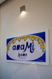 a sign for a hawaiian home on a wall at amaMì home in Vietri