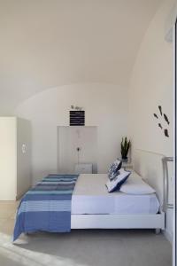 Ένα ή περισσότερα κρεβάτια σε δωμάτιο στο amaMì home
