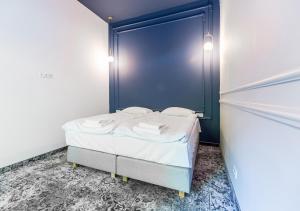 Posteľ alebo postele v izbe v ubytovaní Aparthotel Cracovia Residence