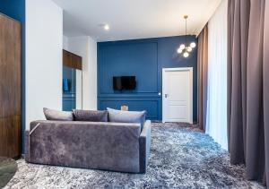 Televízia a/alebo spoločenská miestnosť v ubytovaní Aparthotel Cracovia Residence