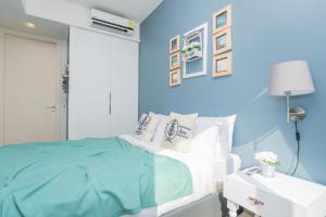 Ein Bett oder Betten in einem Zimmer der Unterkunft Unixx Pattaya by Alvin