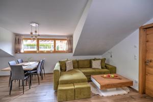 a living room with a couch and a table at Moarhof in Oberbozen in Soprabolzano
