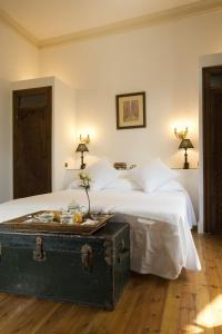 Posada Real Casa de Tepa tesisinde bir odada yatak veya yataklar