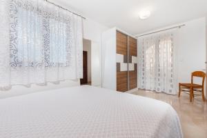 Postel nebo postele na pokoji v ubytování Guesthouse Santin