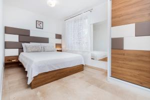 Postel nebo postele na pokoji v ubytování Guesthouse Santin