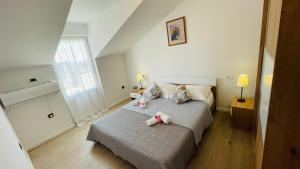 Кровать или кровати в номере Apartman Luka
