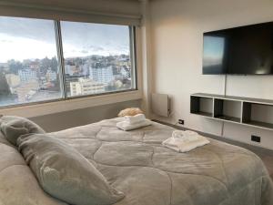 Ένα ή περισσότερα κρεβάτια σε δωμάτιο στο GUEST PATAGONIA HOUSE