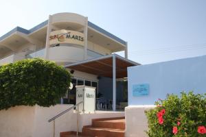 a building with a sign that reads subway markets at Sun Maris in Faliraki